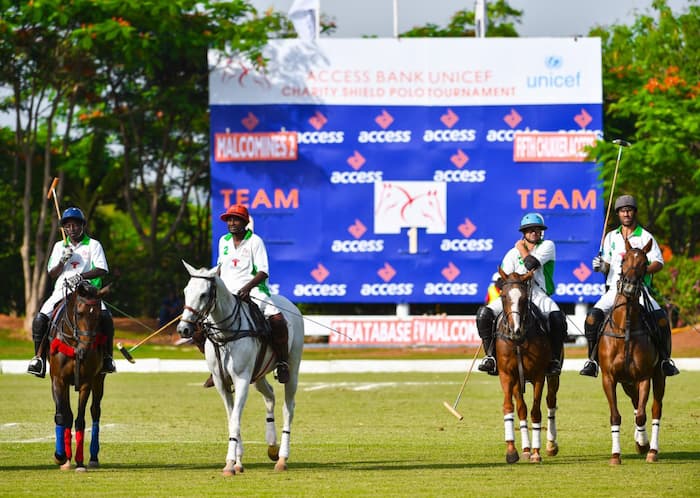 Men riding horses at access competition