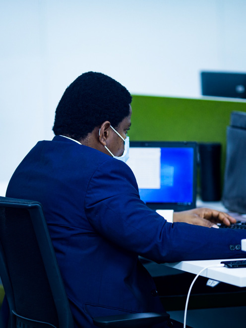 Man working infront of a computer