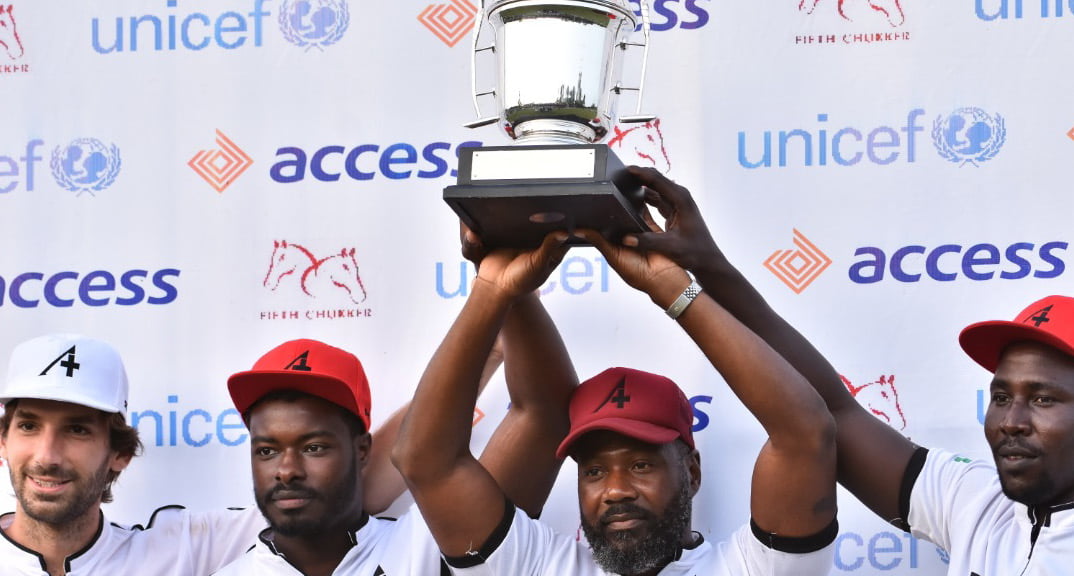 Wiiners raising a trophy at a sport event