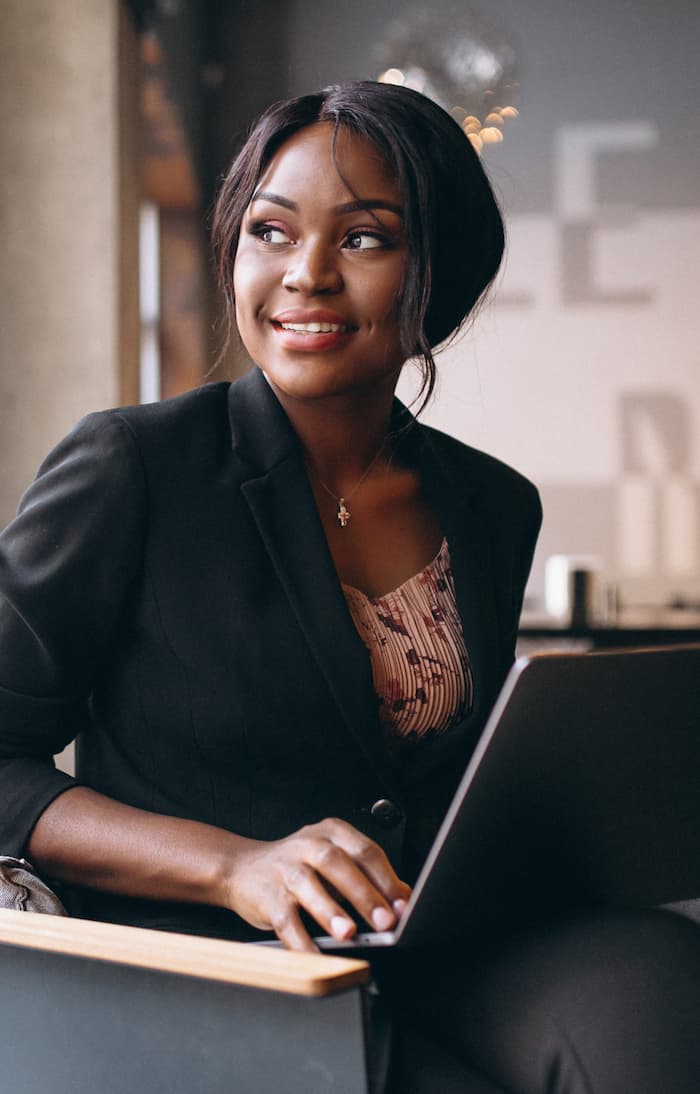 Woman on computer smiling