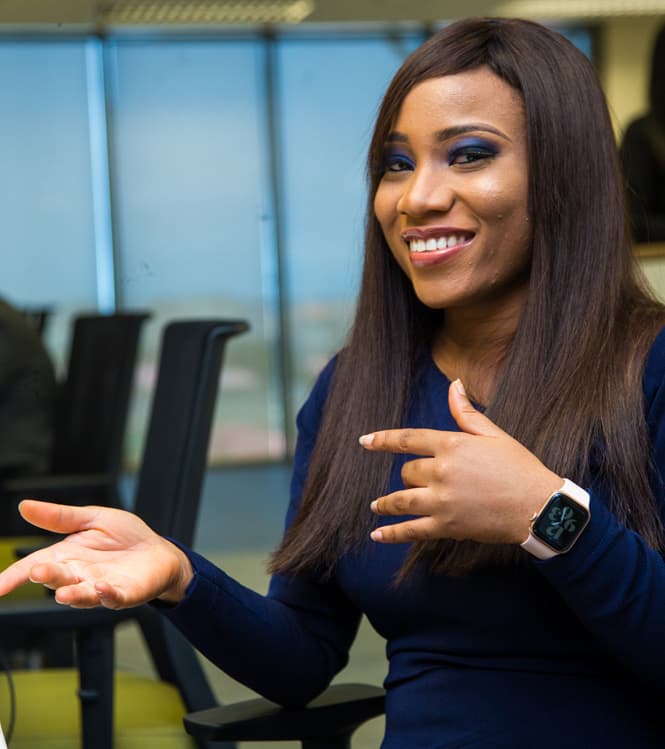Woman smiling and gesturing