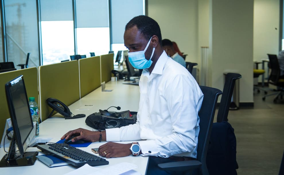 Male Access bank worker using a computer