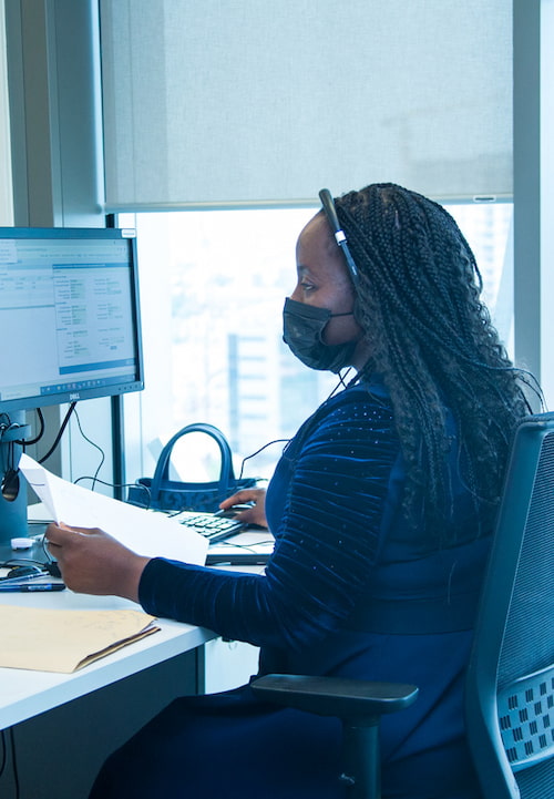 Female Access Bank staff working with a computer